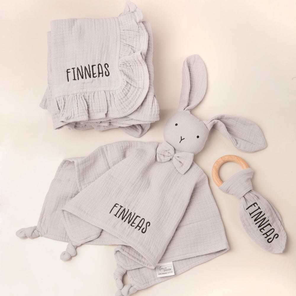 Coordinating personalized blanket, bunny lovey, and teething ring gift set